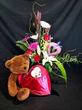 Flowers and a Stuffed Bear
